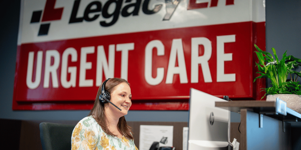 Receptionist on the phone looking at a computer