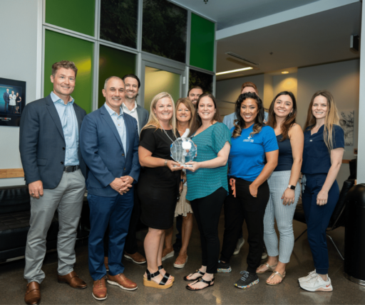 group of the legacy Frisco team with award