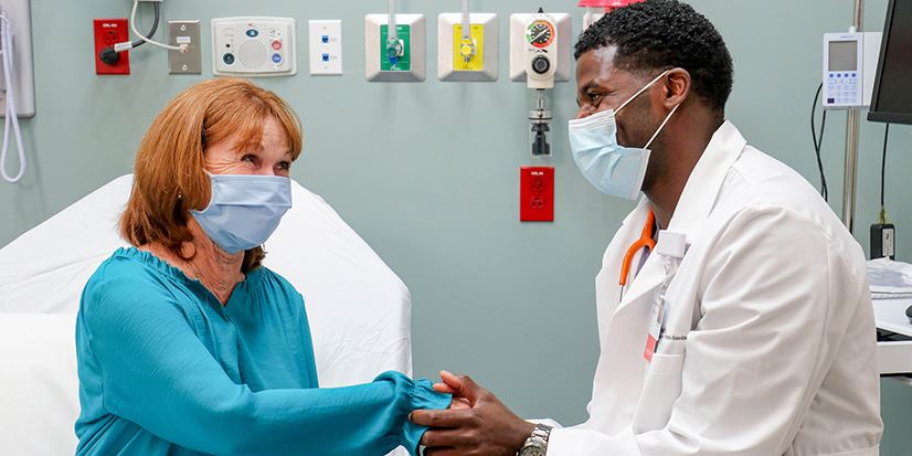 provider holding a patient's hand